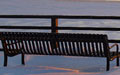 empty bench in snow